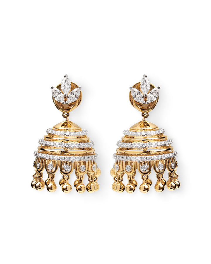 Gold and diamond earrings on a white background