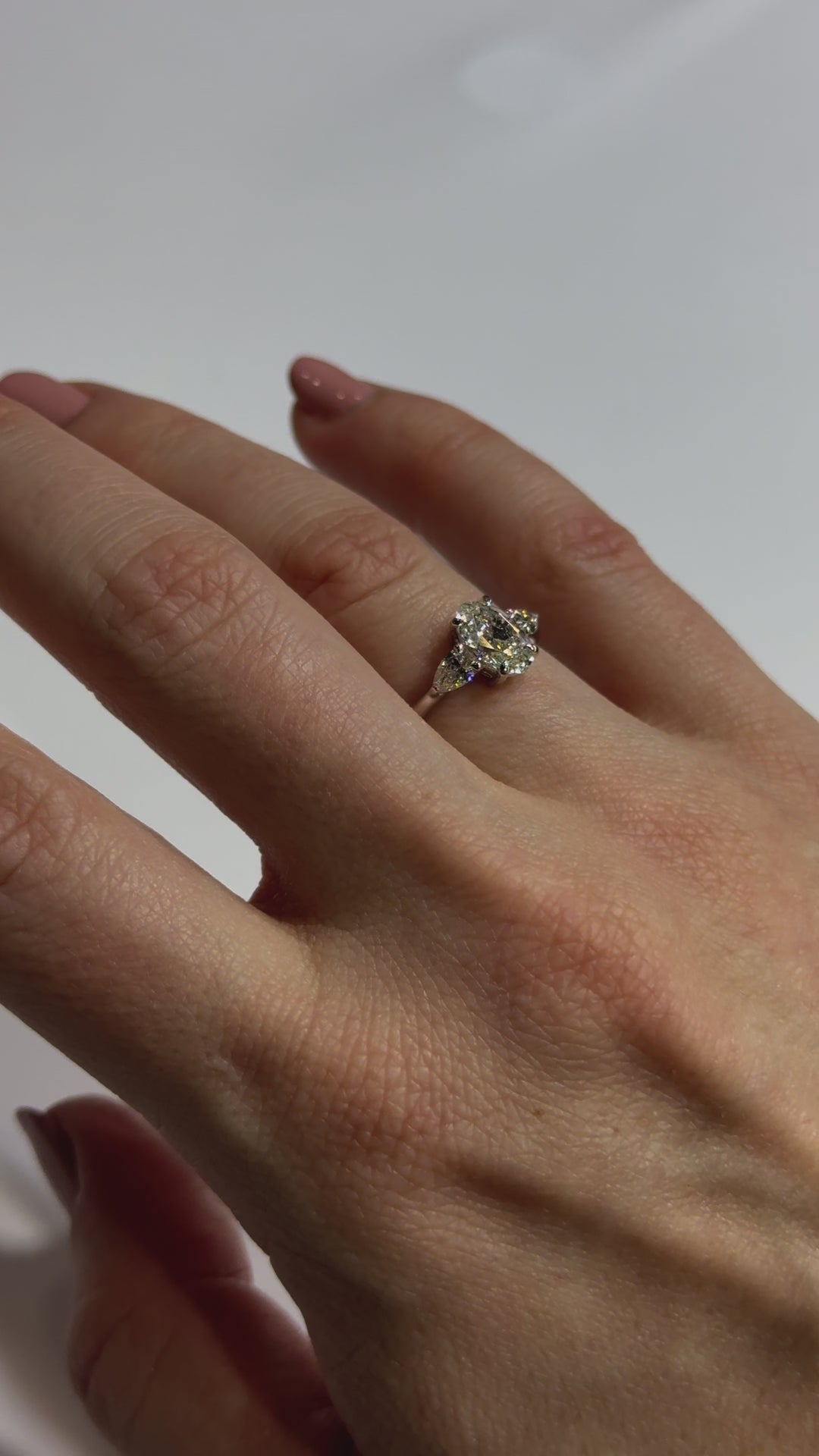 Oval and Pear Diamond Engagement Ring on body